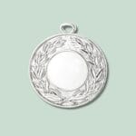 Rund sølvmedalje med laurbærkrans design.