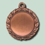 Bronzemedalje med bladkant på lysegrøn baggrund