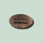 Dørskilt med Lis og Tobias Jørgensen, nummer 83