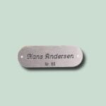 Metalnavneskilt med teksten Hans Andersen, nr. 86