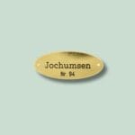 Messingskilt med navnet Jochumsen og nummer 94