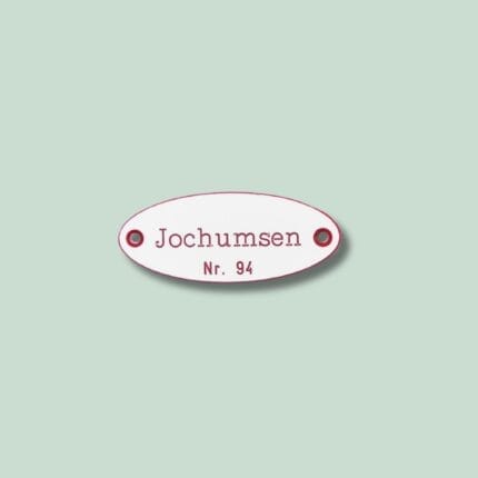 Ovalt skilt med teksten 'Jochumsen Nr. 94'.