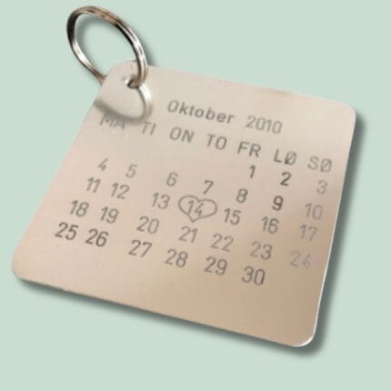 Nøglering med kalender for oktober 2010 og hjerte