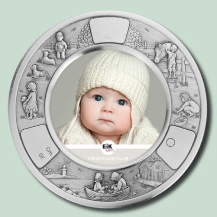 Sølvramme med baby i strikket hue.