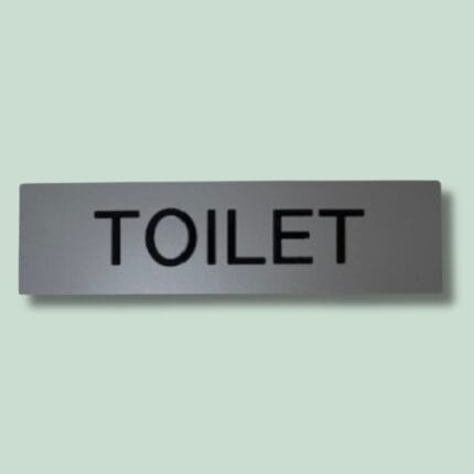 Toiletskilt med teksten 'TOILET'