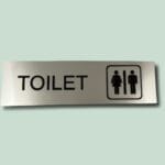 Toiletskilt med ikon for mænd og kvinder
