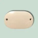 Oval beige plastikdæksel med to huller