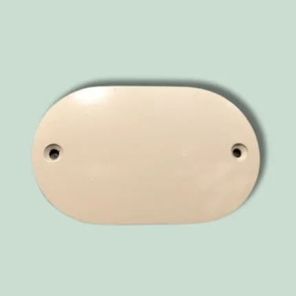 Oval beige plastikdæksel med to huller