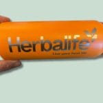 Orange flaske med Herbalife logo og slogan.