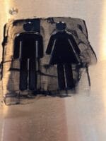 Herre- og dametoilette symboler på skilt.